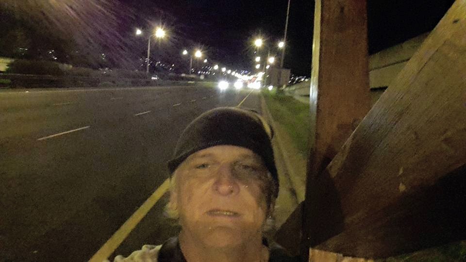 Walking night time on the busy N1 in Cape Town with the cross